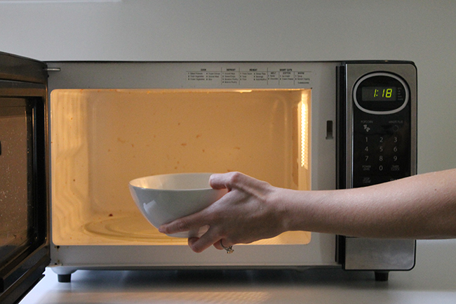 Clean your microwave with a bowl of lemon slices and water