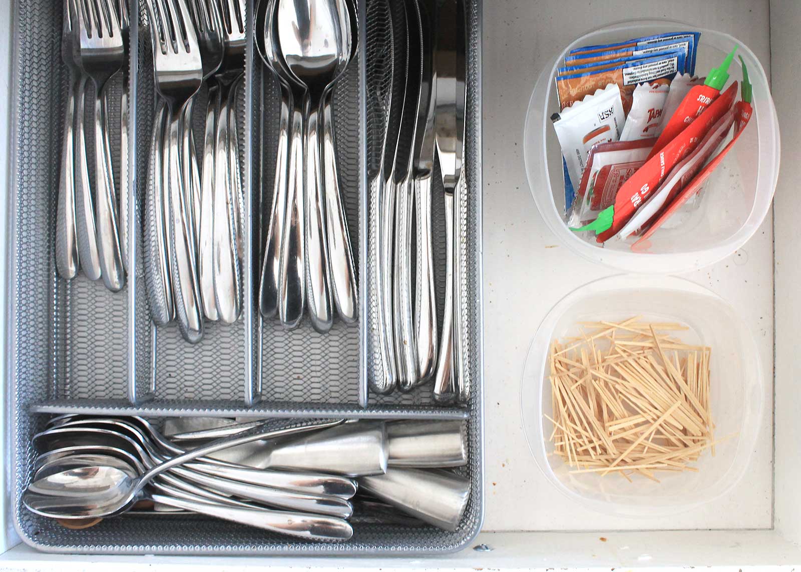 Repurpose plastic containers to store junk drawer items