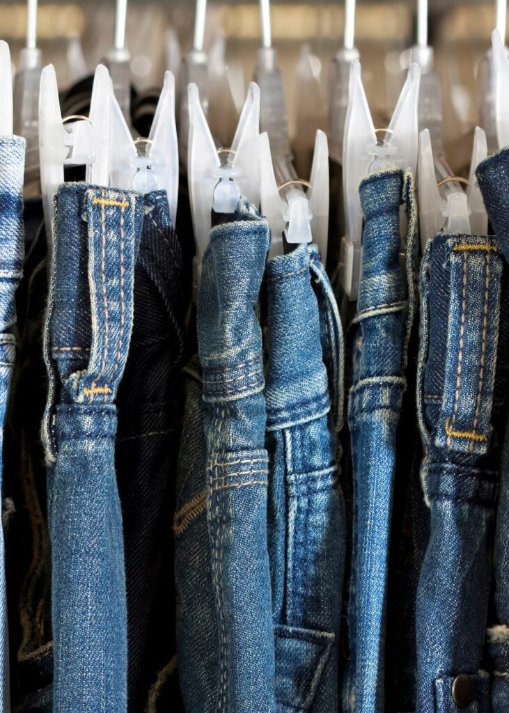 Blue jeans on clip hangers - How to organize jeans