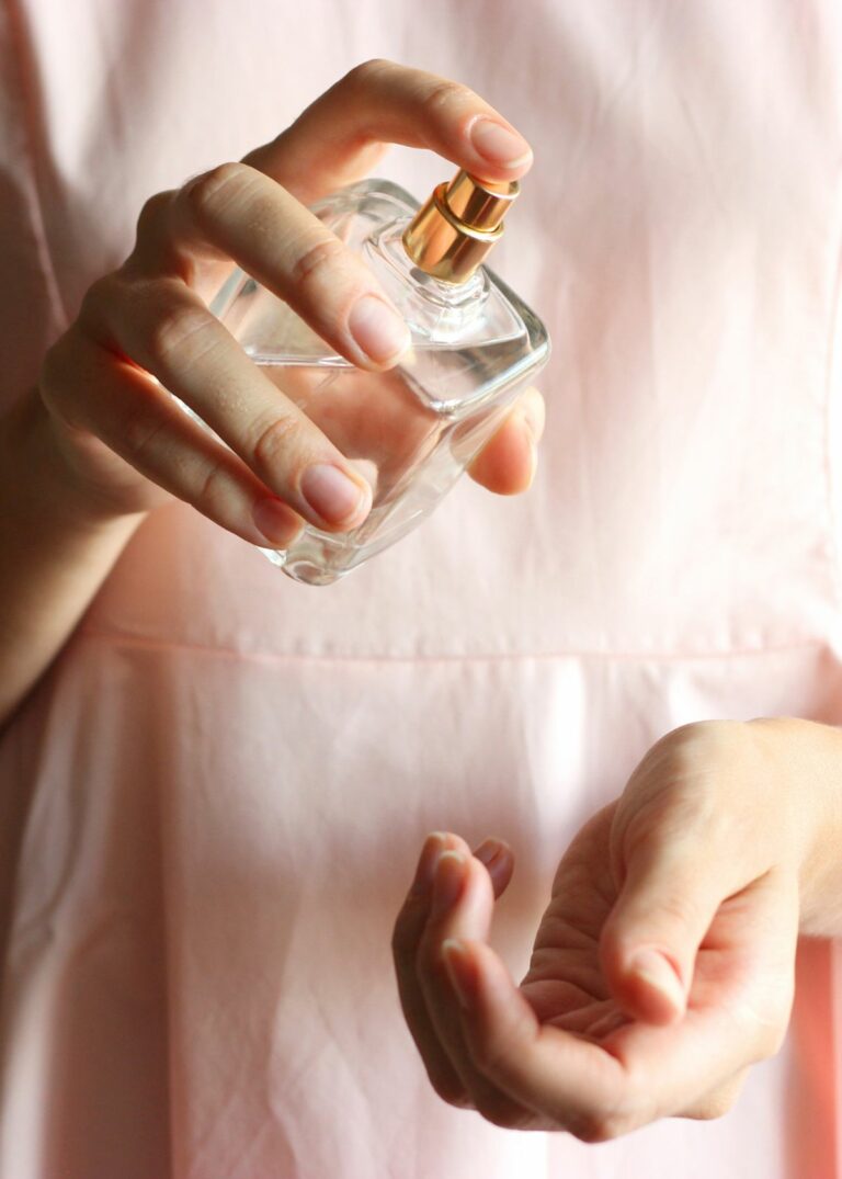 Perfume in female's hands - How to Remove Perfume Smell from Clothes