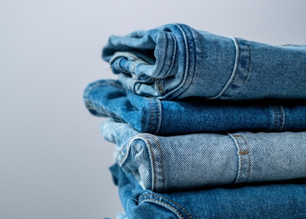 Pile of denim blue jeans - how to organize jeans