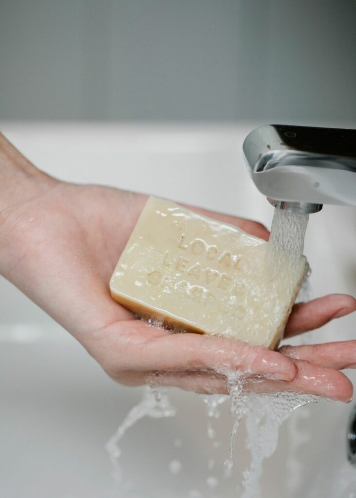 Person washing hands using bar soap - How to wash hands with bar soap