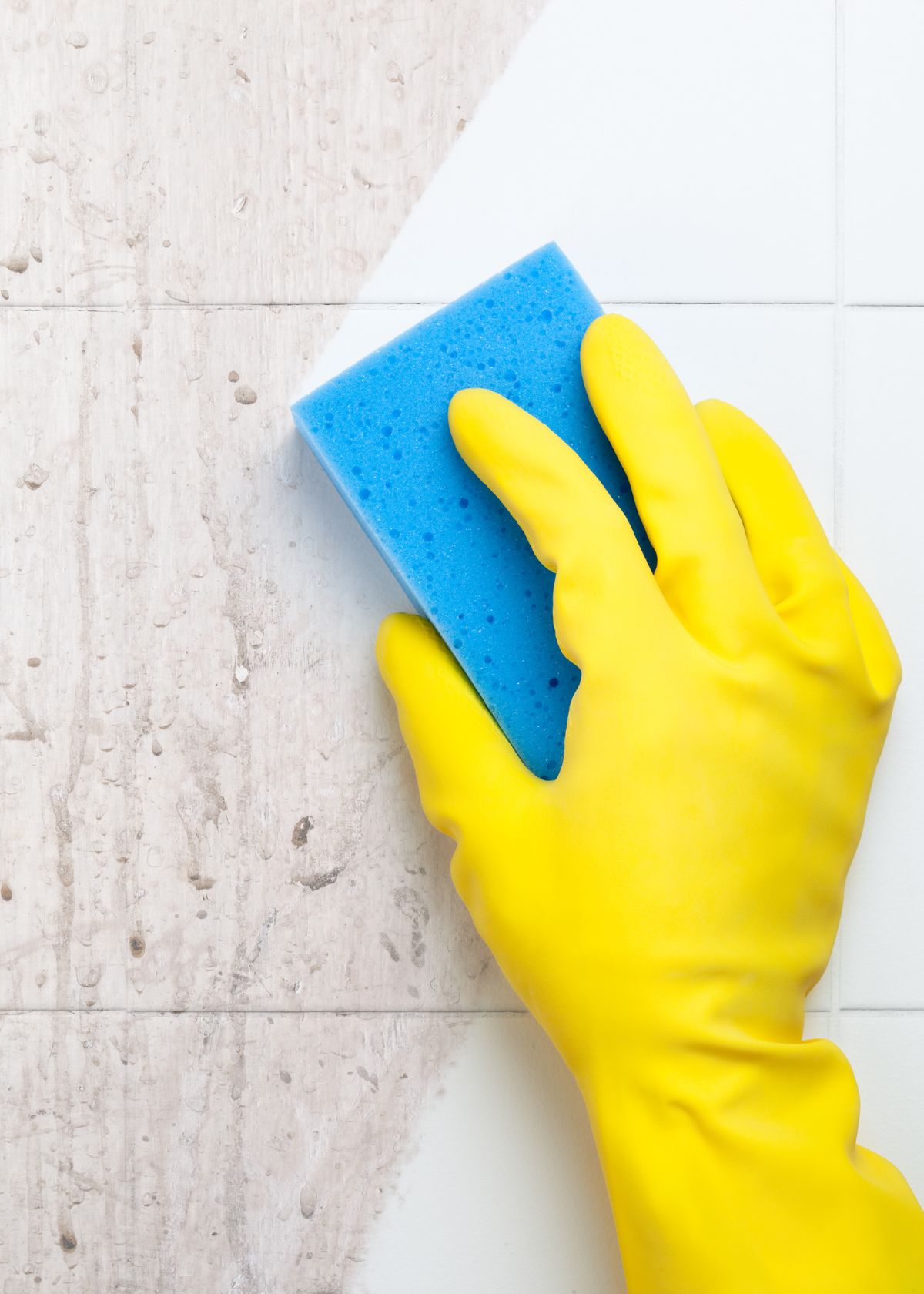 Closeup person cleaning tiles - How to Clean Matte Porcelain Tiles