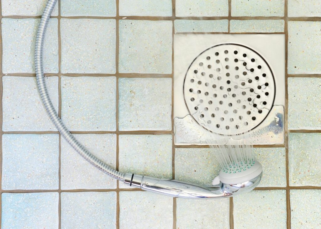 Bathroom floor with shower head - How to Clean a Shower Floor