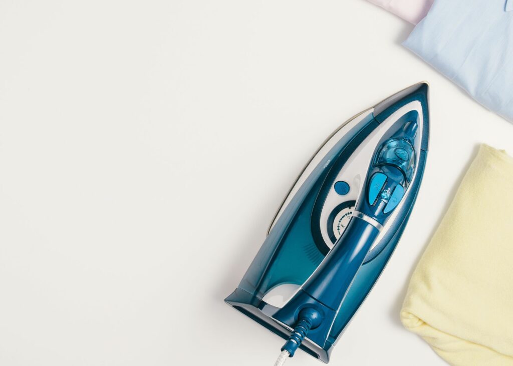 Top view ironing clothes - Steam Iron vs. Dry Iron 