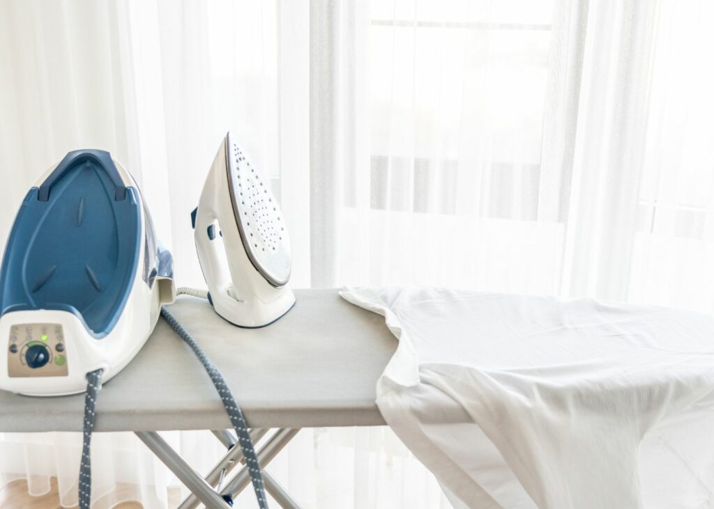 Steaming iron on ironing board - steam iron vs. dry iron